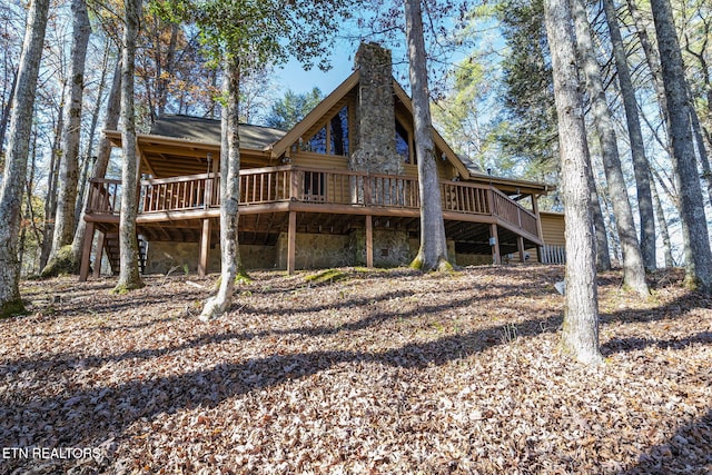 rear view of property with a deck