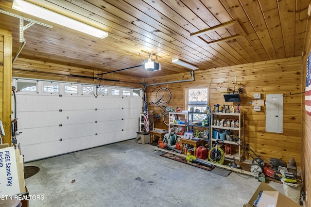 garage featuring electric panel, wood walls, wood ceiling, and a garage door opener