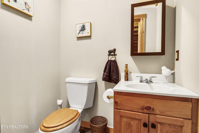 bathroom with toilet and vanity