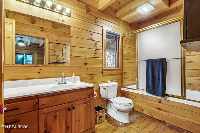 full bathroom with hardwood / wood-style floors, bath / shower combo with glass door, beamed ceiling, and wooden walls