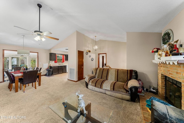 living room with light carpet, vaulted ceiling, a fireplace, and ceiling fan