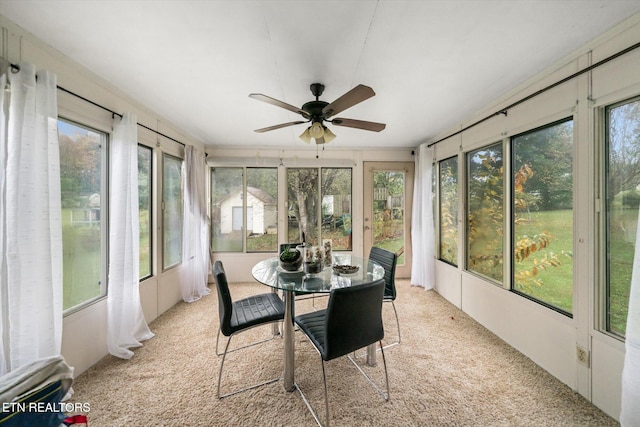 sunroom / solarium with ceiling fan and plenty of natural light