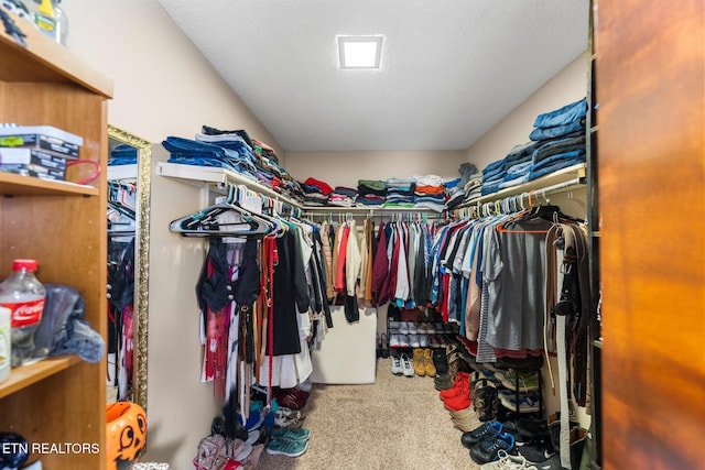 walk in closet featuring carpet