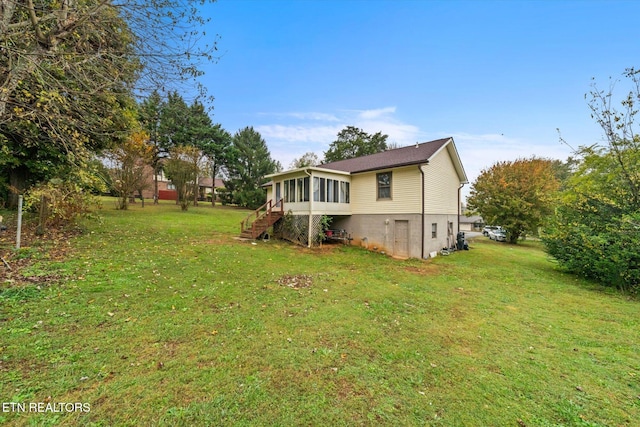 view of yard featuring a sunroom