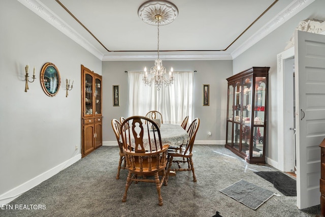 carpeted dining room featuring a notable chandelier and crown molding