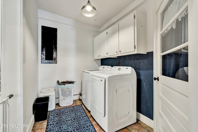 laundry area with washer and clothes dryer and cabinets