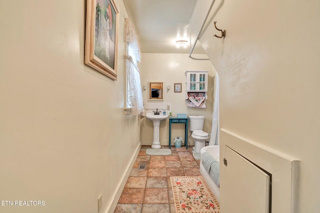 bathroom with toilet and sink