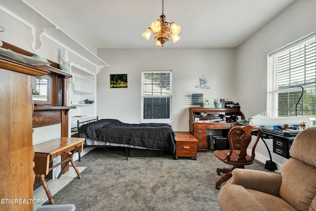 bedroom featuring an inviting chandelier and carpet floors