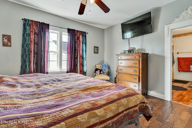 bedroom featuring dark hardwood / wood-style floors and ceiling fan