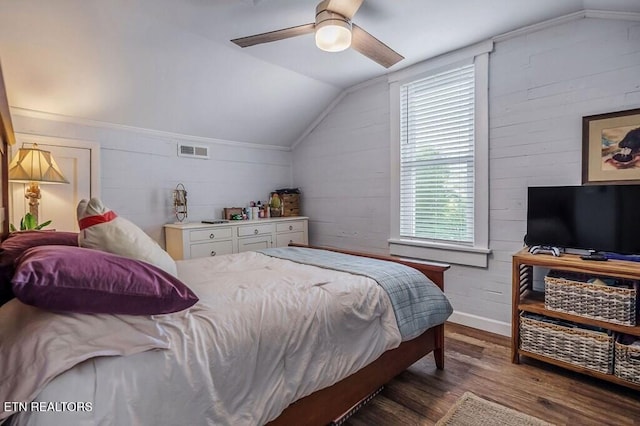 bedroom featuring vaulted ceiling, dark hardwood / wood-style floors, and ceiling fan