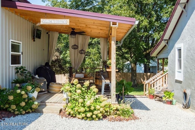 view of patio / terrace with a wooden deck and ceiling fan