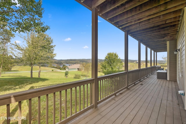 deck featuring a lawn