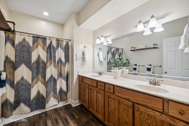 bathroom with vanity, hardwood / wood-style flooring, and a shower with curtain