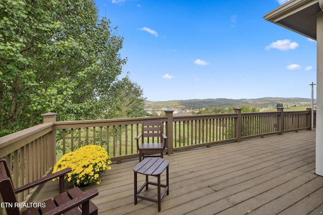 wooden terrace with a mountain view