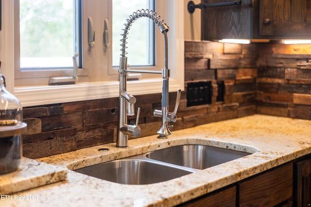 159 Garfield Ln, Sharps Chapel, TN 37866 - kitchen with a sink, dark brown cabinets, plenty of natural light, and light stone countertops