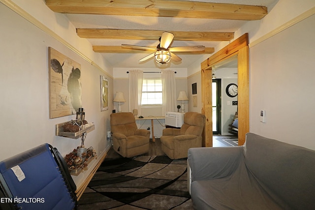 living room featuring beamed ceiling and ceiling fan