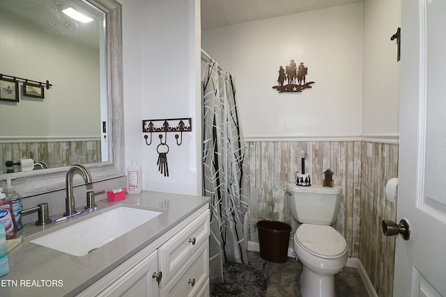 bathroom with toilet, wood walls, vanity, and a shower with shower curtain