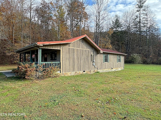 view of home's exterior with a yard