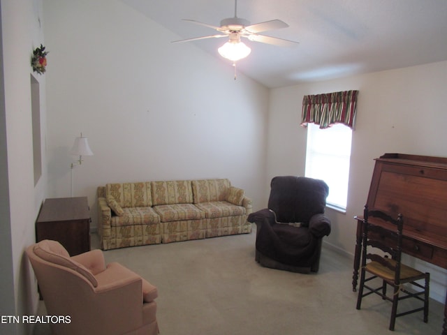 living room featuring ceiling fan, carpet, and vaulted ceiling