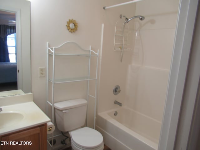 full bathroom featuring bathtub / shower combination, vanity, and toilet