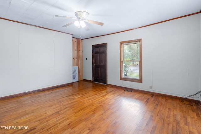 unfurnished room featuring ornamental molding, light hardwood / wood-style flooring, and ceiling fan