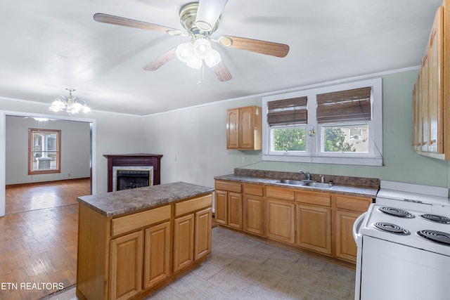 kitchen with light hardwood / wood-style floors, ceiling fan with notable chandelier, sink, and white stove