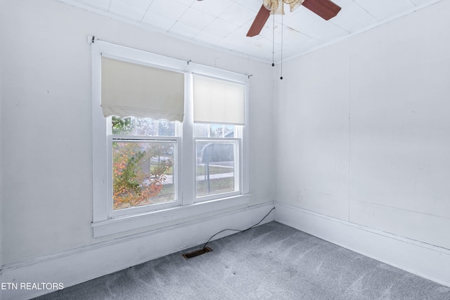 unfurnished room featuring carpet flooring and ceiling fan