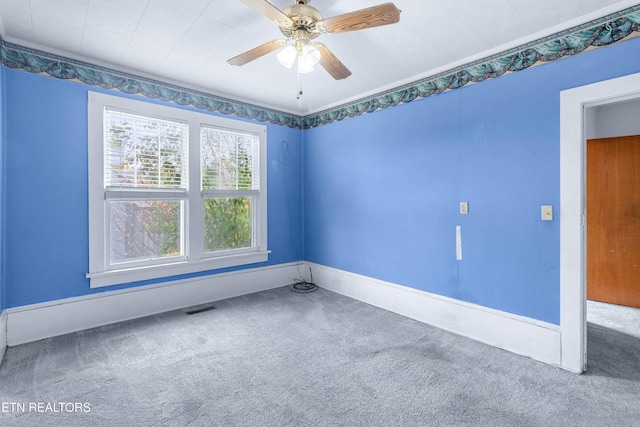 carpeted empty room with ceiling fan