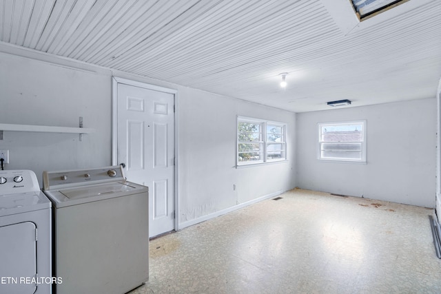 clothes washing area with separate washer and dryer