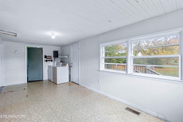 unfurnished living room with washing machine and clothes dryer