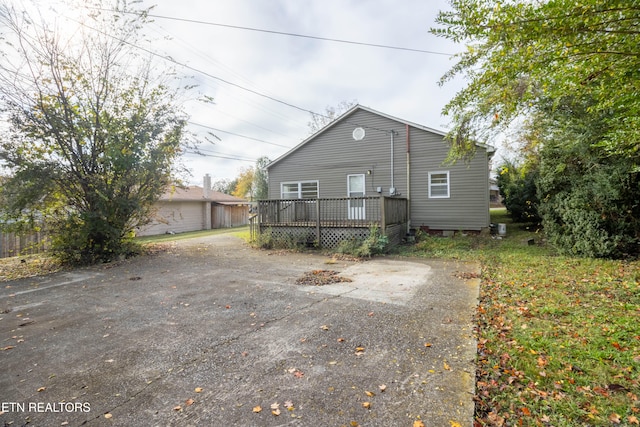 rear view of house featuring a deck