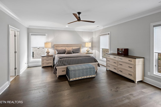 bedroom featuring dark hardwood / wood-style flooring, ceiling fan, and crown molding