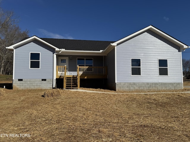 back of property featuring crawl space, covered porch, and roof with shingles