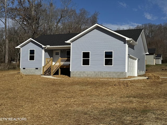 view of front of house featuring a porch, crawl space, roof with shingles, and an attached garage