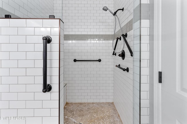 full bathroom featuring a shower stall
