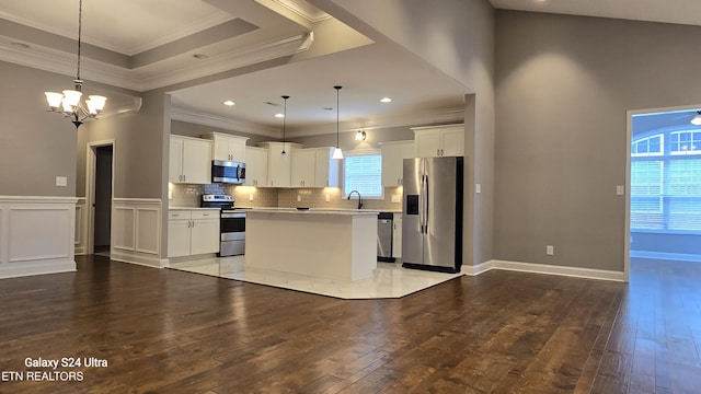 kitchen featuring an inviting chandelier, light countertops, stainless steel appliances, and light wood-style floors