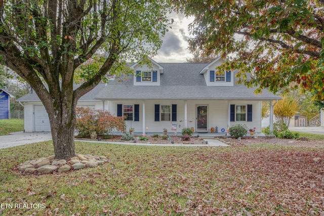 cape cod home with a front yard and covered porch