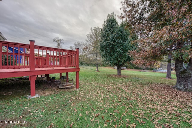 view of yard with a wooden deck