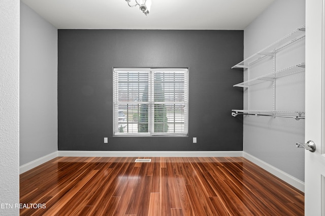 interior space with visible vents and wood finished floors