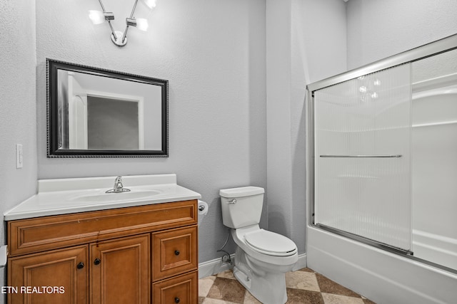 full bathroom featuring vanity, toilet, and enclosed tub / shower combo