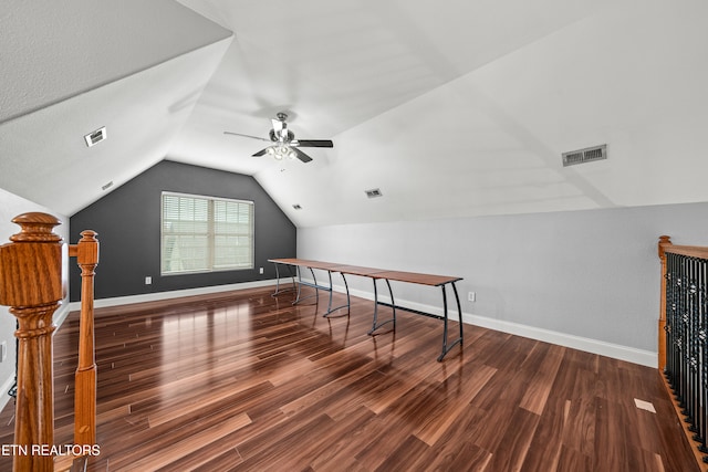 bonus room with dark hardwood / wood-style flooring, ceiling fan, and vaulted ceiling