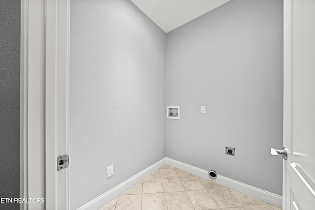 washroom featuring laundry area, hookup for an electric dryer, tile patterned flooring, baseboards, and hookup for a washing machine