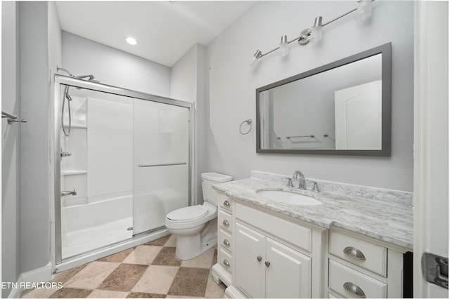 full bathroom with vanity, toilet, and a shower stall
