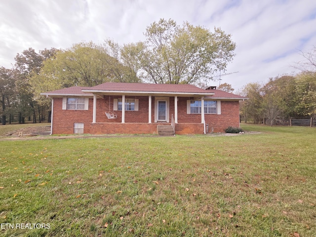 single story home featuring a front yard