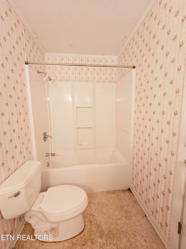 bathroom with ornamental molding, shower / tub combination, a textured ceiling, and toilet