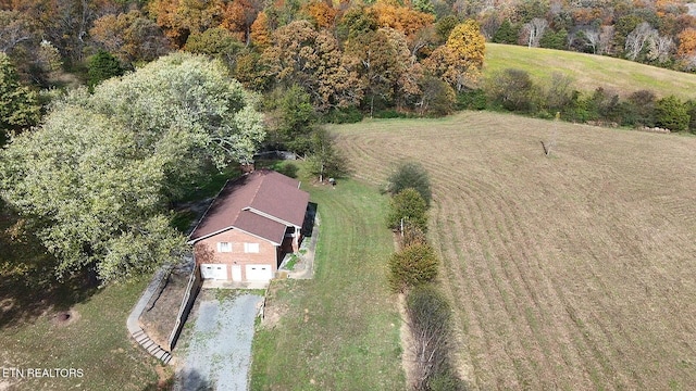 birds eye view of property with a rural view