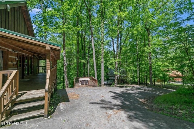 view of patio featuring an outbuilding