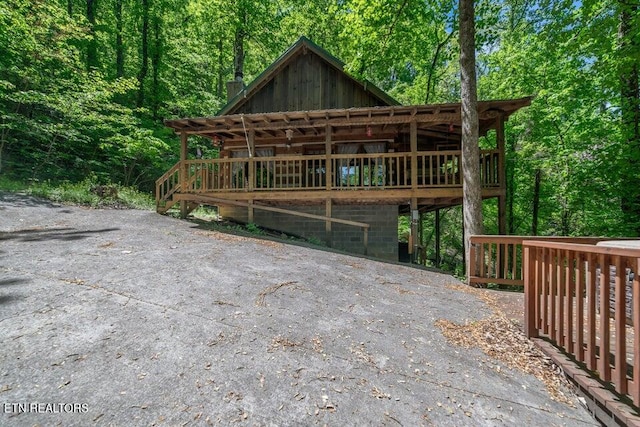 exterior space featuring a wooden deck