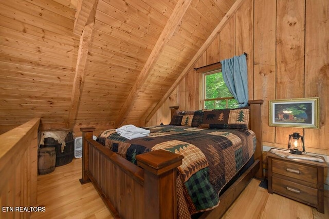 bedroom with lofted ceiling with beams, light hardwood / wood-style flooring, wood walls, and wooden ceiling