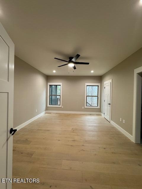 spare room with light wood-style floors, baseboards, a ceiling fan, and recessed lighting